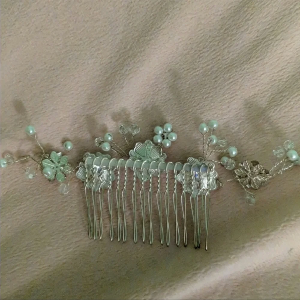 Silver beaded hair piece.